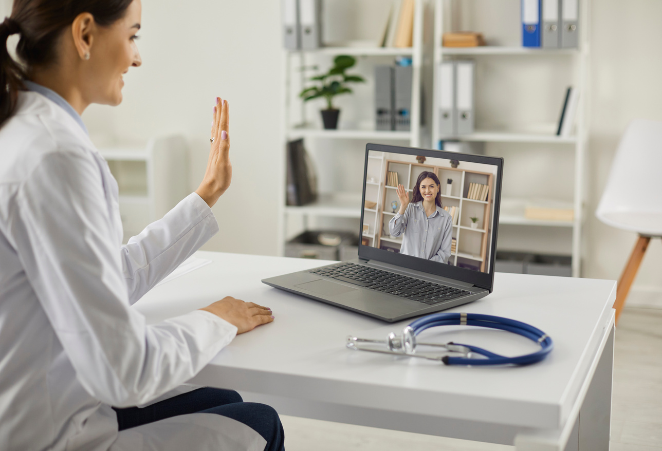 Doctor Waving Hand at Laptop Starting Online Virtual Medical Consultation with Patient